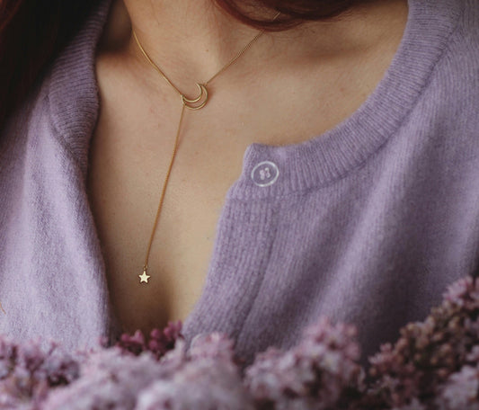 woman wearing purple sweater and musk perfume