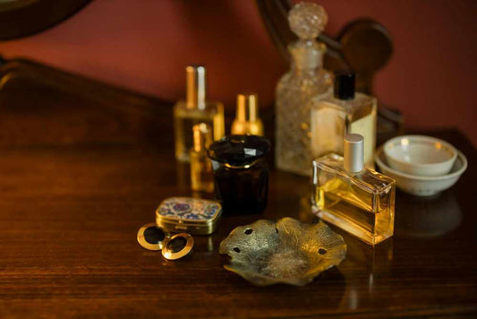perfume collection on a dresser