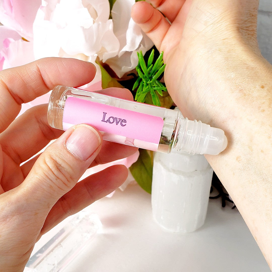 love perfume oil roll-on applying to wrist