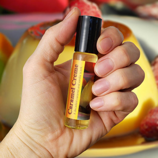 holding caramel creme perfume oil bottle