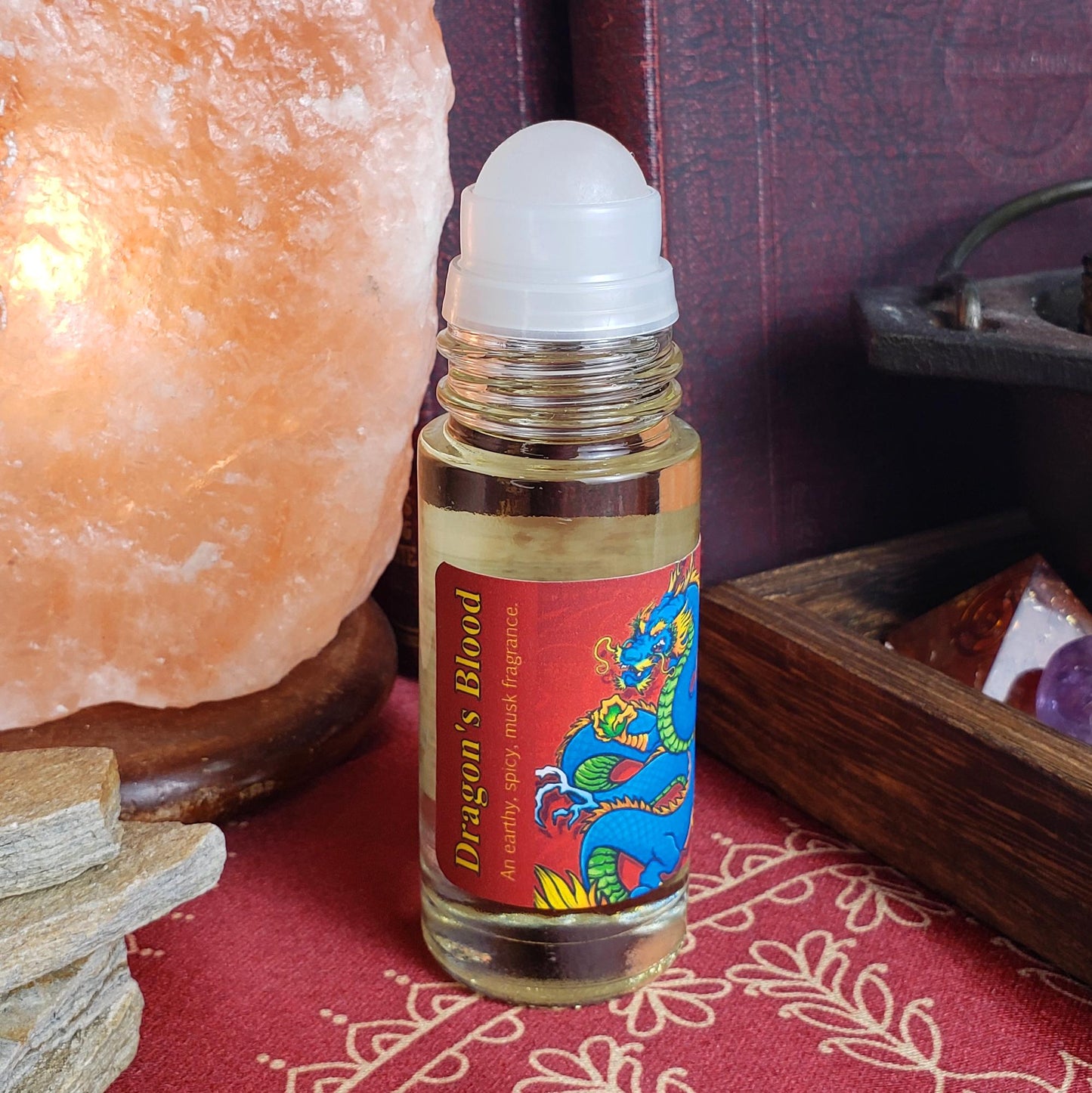 dragon's blood perfume oil with rollerball in the large one ounce bottle