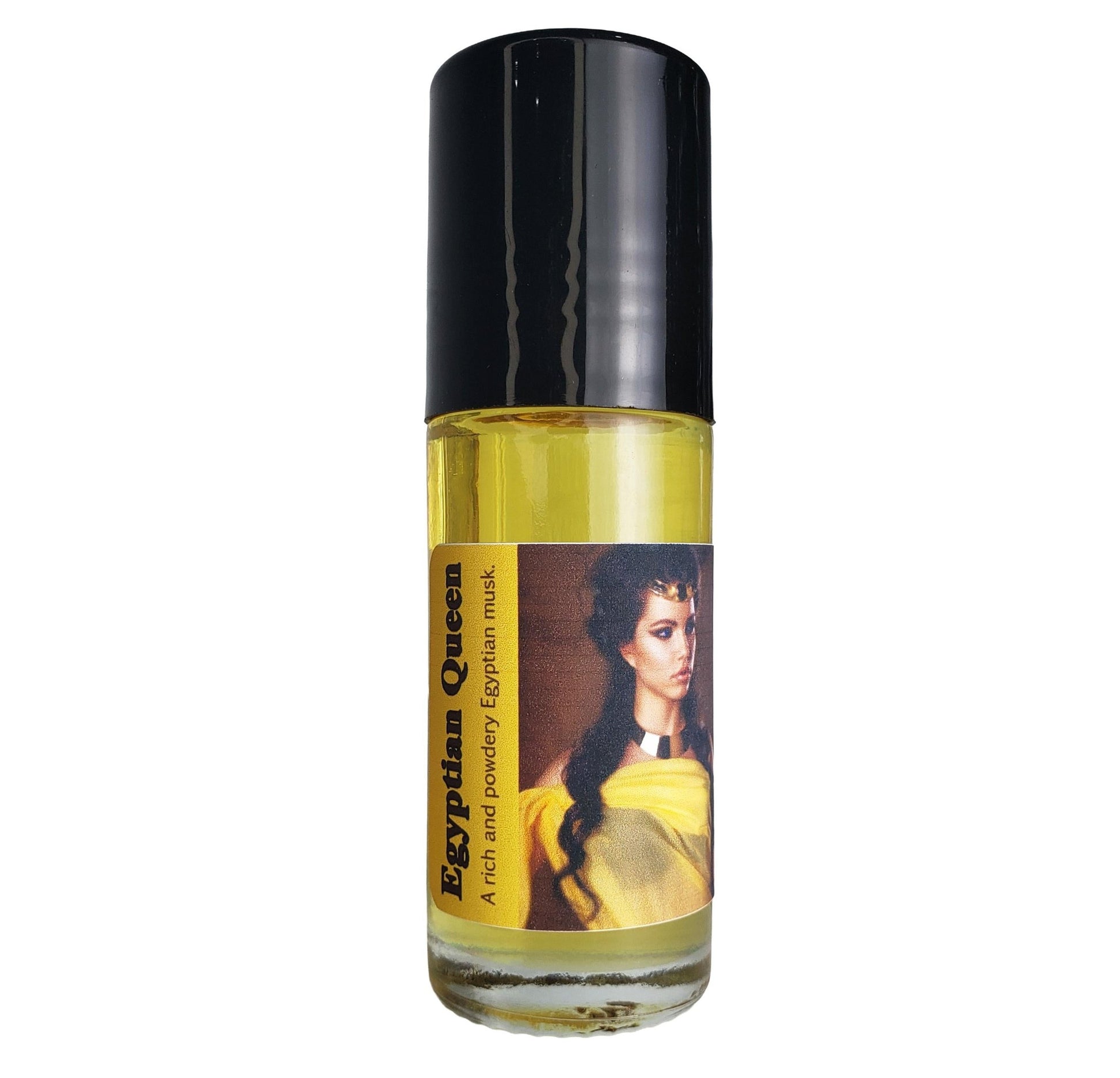 A small cylindrical bottle of Egyptian Queen perfume oil with a black cap covering the rollerball, containing yellow perfume oil, on a plain white background.