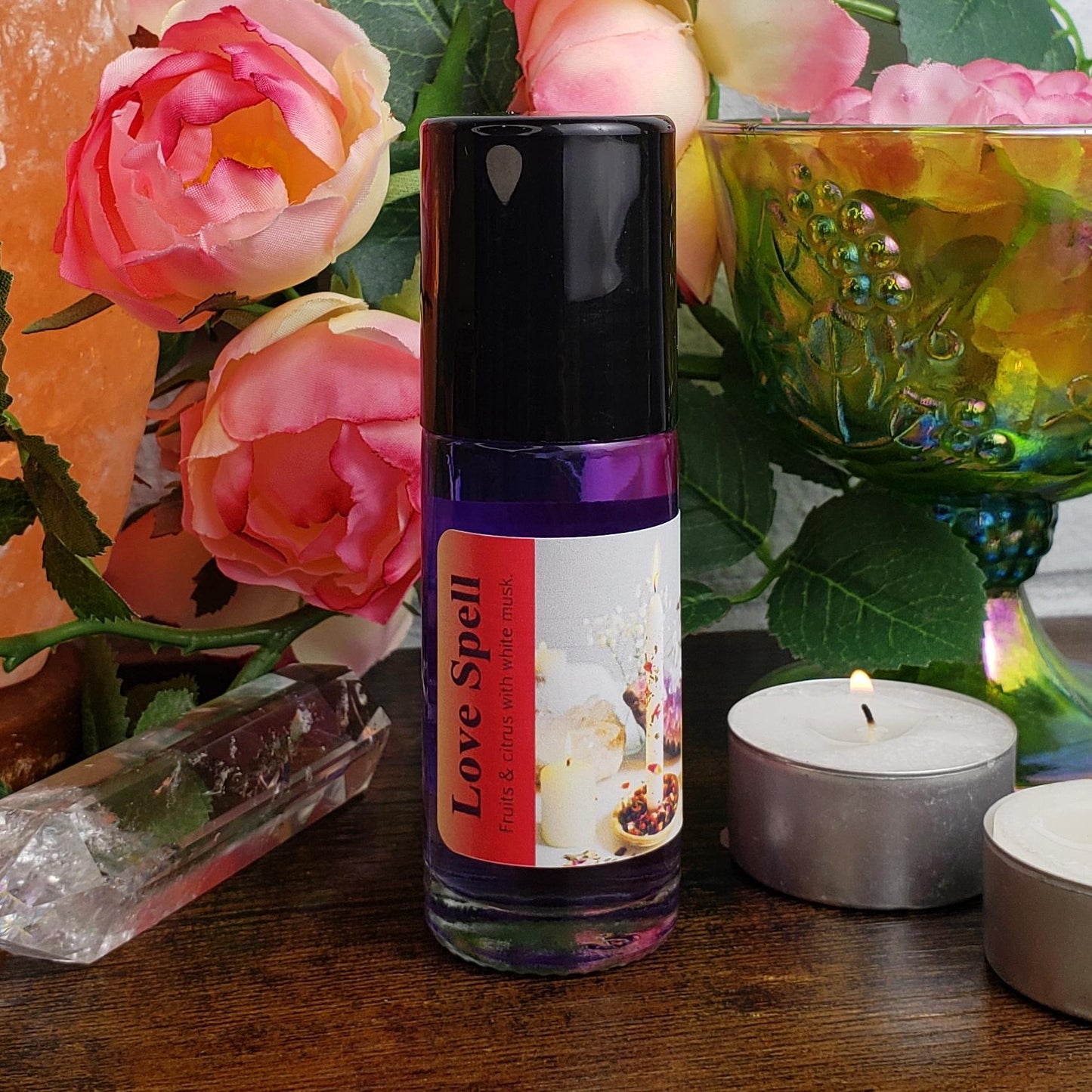 The Left side of the label for Love Spell perfume oil by Shadow Scents, showing the product name and description and the black cap. 