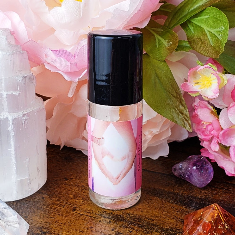 love perfume oil bottle with cap on showing artwork