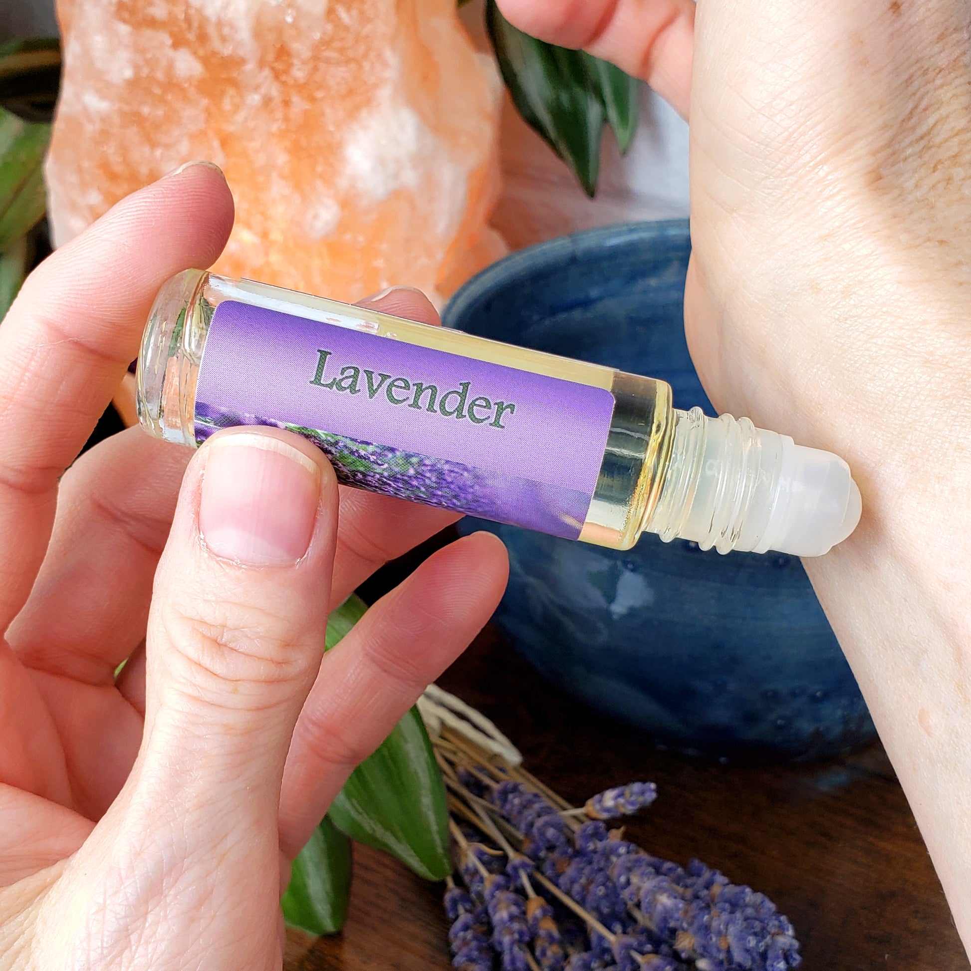 lavender roll-on perfume oil wearing on wrist